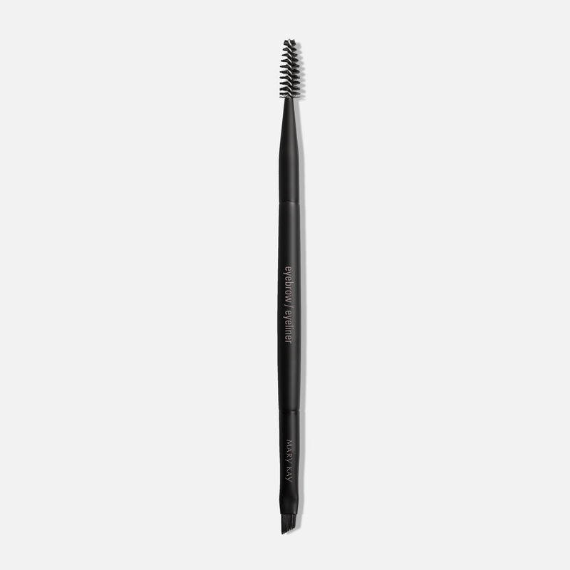 Mary Kay Eyebrow Eyeliner Brush standing against a plain background.