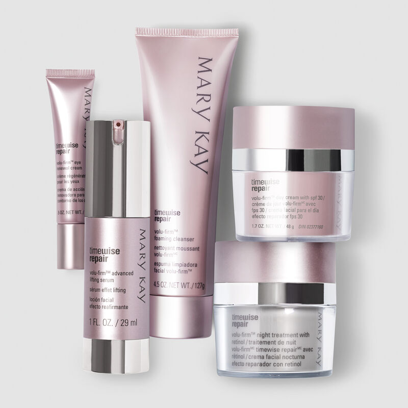 The entire Mary Kay TimeWise Repair Volu-Firm regimen against a gray background.