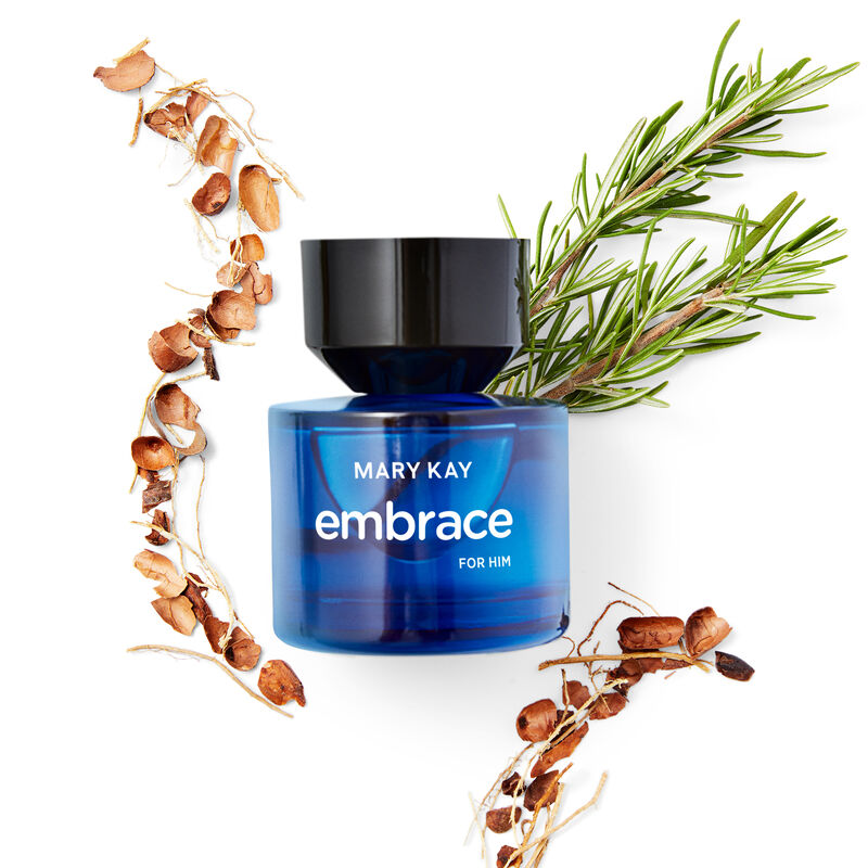 Ingredients that comprise the fragrance notes of Mary Kay Embrace for Him Eau de Toilette in their natural state styled around the fragrance bottle