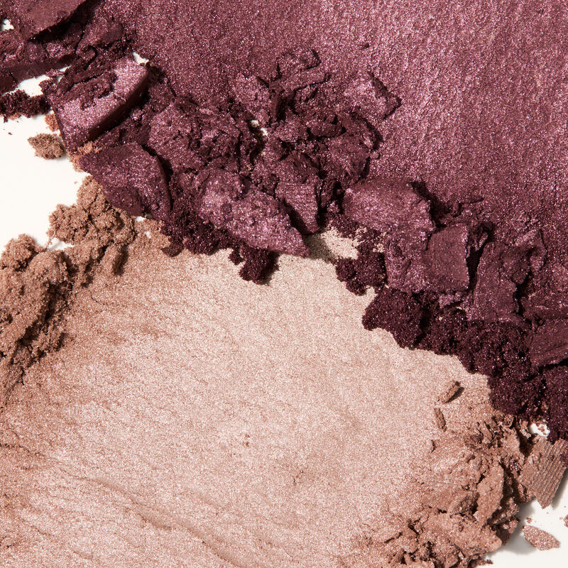 Product rubs of both colors of special-edition Mary Kay At Play Eye Shadow Duo in Rosy Plum on white background